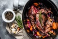 Roasted Rabbit Haunches in stewpot with  Stewed Vegetables. Cooking stew. Top view Royalty Free Stock Photo