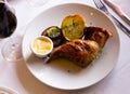 Roasted rabbit leg with grilled potato, eggplant, onion and aioli sauce Royalty Free Stock Photo