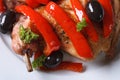 Roasted rabbit leg with peppers macro. horizontal top view Royalty Free Stock Photo