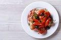 Roasted rabbit leg with peppers and olives top view horizontal Royalty Free Stock Photo