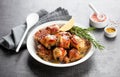 Roasted rabbit meat sliced with garlic, lemon and rosemary Royalty Free Stock Photo