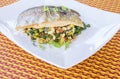 Roasted Rainbow Trout on a Bed of Spring Vegetables Royalty Free Stock Photo