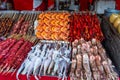 Roasted and raw insects, silkworms, scorpions, bugs, shrimps, crabs, langoustes, snakes, dog meat, on stick