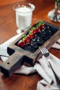 Roasted red beef ribs, meat on bone, black rice on plate Royalty Free Stock Photo