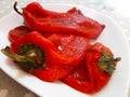 Roasted red peppers on plate. Ardei copti