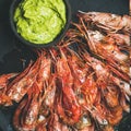 Roasted red shrimps with guacamole avocado sauce, square crop