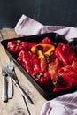 Roasted red and yellow peppers in baking tray Royalty Free Stock Photo