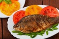 Roasted river fish carp on a white plate Royalty Free Stock Photo