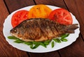 Roasted river fish carp on a white plate Royalty Free Stock Photo