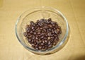 Roasted robusta coffee beans on bowl glass Royalty Free Stock Photo