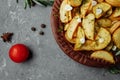 Roasted rosemary garlic potato wedges on a plate Royalty Free Stock Photo