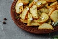 Roasted rosemary garlic potato wedges on a plate Royalty Free Stock Photo