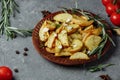 roasted rosemary garlic potato wedges on a plate Royalty Free Stock Photo