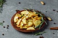 Roasted rosemary garlic potato wedges on a plate Royalty Free Stock Photo