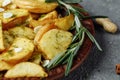 Roasted rosemary garlic potato wedges on a plate Royalty Free Stock Photo