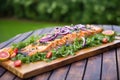 roasted salmon on cedar plank with garden salad