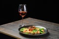 Roasted salmon fillet with bulgur with glass of rose wine Royalty Free Stock Photo