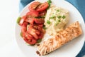 Roasted salmon fillet with parsnip puree, tomato salad and parsly