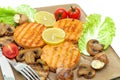Roasted salmon medallions with mushrooms and vegetables closeup Royalty Free Stock Photo