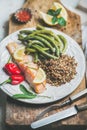 Roasted salmon with quinoa, pepper and poached beans in plate Royalty Free Stock Photo