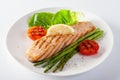 Roasted salmon steak with asparagos tomatoes  with fresh vegetable Royalty Free Stock Photo