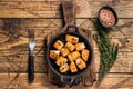 Roasted salmon or trout fish in a pan. Wooden background. Top View Royalty Free Stock Photo