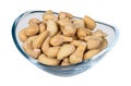 Roasted salted cashew nuts in glass bowl isolated on white background. Anacardium occidentale