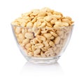 Roasted salted peanuts in glass bowl isolated on white background Royalty Free Stock Photo
