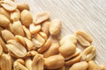 Roasted salted peanuts on wooden background