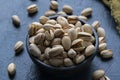 Roasted And Salted Pistachios In Ceramic Bowl