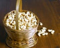 Roasted salted raw cashew nuts in wooden bowl on rustic table, healthy vegetarian snack, Anacardium occidentale, Cashews on white Royalty Free Stock Photo