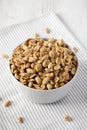 Roasted Salted Shelled Peanuts in a Gray Bowl, side view Royalty Free Stock Photo