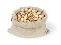 Roasted salty pistachios nuts in sack bag