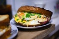 Roasted sandwich with sausage, egg, cheese and green onions. juicy double toast bread sandwich