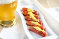 Roasted sausages with glass of beer Royalty Free Stock Photo