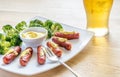 Roasted sausages with mustard sauce Royalty Free Stock Photo