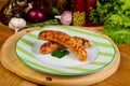 Roasted sausages in the plate Royalty Free Stock Photo