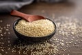 Roasted sesame seeds in bowl on wooden table Royalty Free Stock Photo