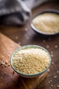Roasted sesame seeds in bowl on wooden table Royalty Free Stock Photo