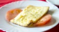 roasted sheep cheese and tomato slices in a plate