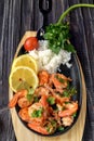 Roasted shrimps with lemon, garlic,herbs and white rise, seafood