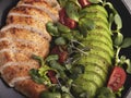 Roasted sliced chicken fillet with avocado, tomato, sunflower sprouts healthy