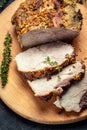 Roasted sliced Christmas ham of turkey. large piece of baked pork with mustard on a cutting board. banner, menu recipe vertical