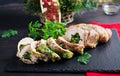 Roasted sliced Christmas roll of turkey with spinach and cheese