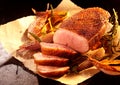 Roasted sliced duck breast and onions