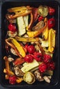 Roasted sliced vegetables on a baking tray