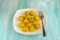 Roasted small potato tubers with spices on white plate