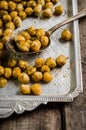 Roasted spicy chickpeas with zaatar or zatar on vintage metall try and wooden background. Top view Royalty Free Stock Photo