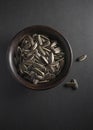 A bowl filled with roasted sunflower seeds. Royalty Free Stock Photo