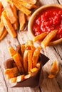 roasted sweet potato fries and ketchup close-up. Vertical, Rustic Royalty Free Stock Photo